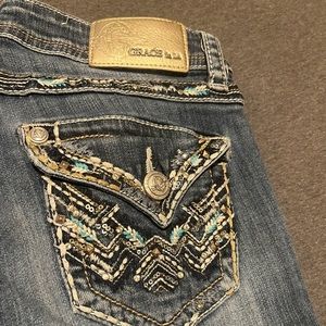 blue boot cut , rhinestone jeans